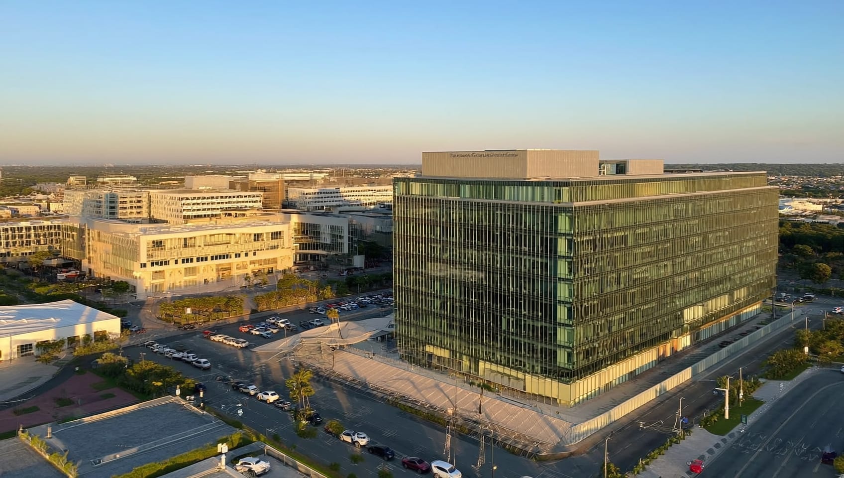 Modern glass commercial office building at golden hour